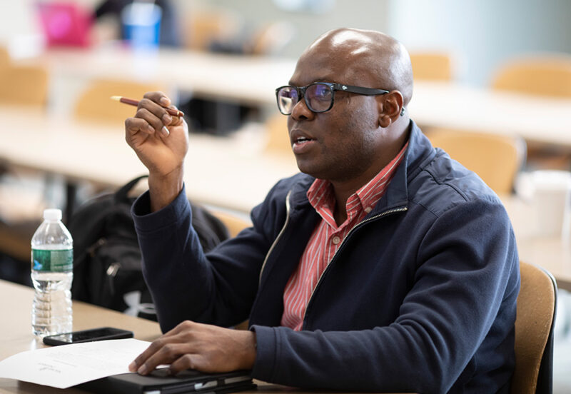 Student sitting and asking a question